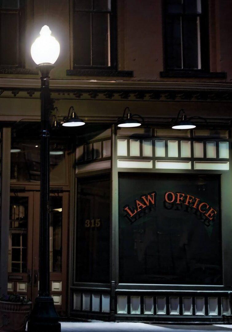 A lamp post in front of an office building.